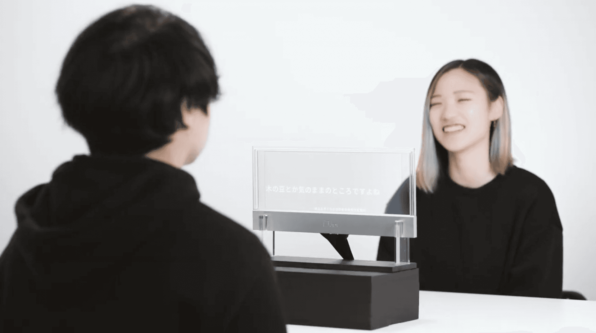 See-Through Captions — transparent subtitle display for face-to-face communication